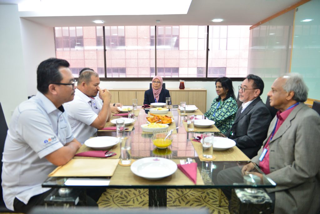 a group of people sitting around a table